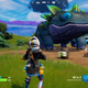 A screenshot of a Fortnite player encountering a dino-like Klombo for the first time.